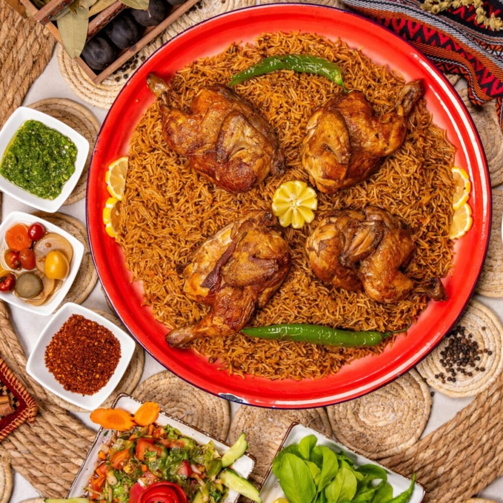 A vibrant platter of grilled chicken and spiced rice with assorted side dishes.