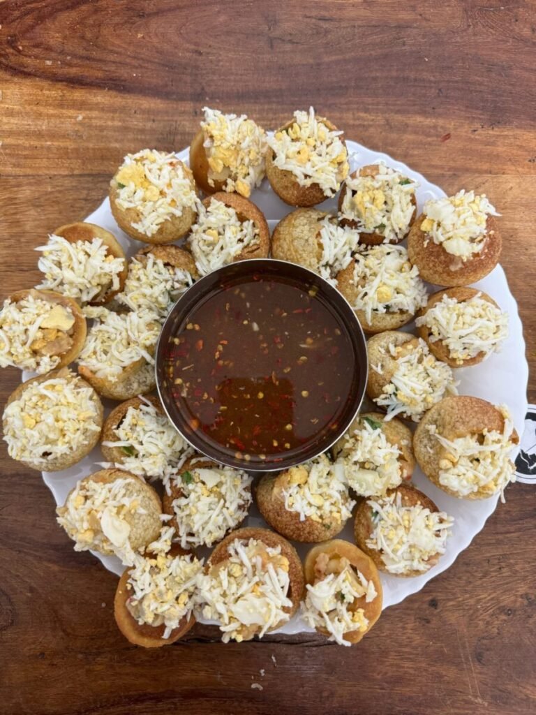 Plate of Indian fuchka with spicy sauce, perfect for a savory snack.