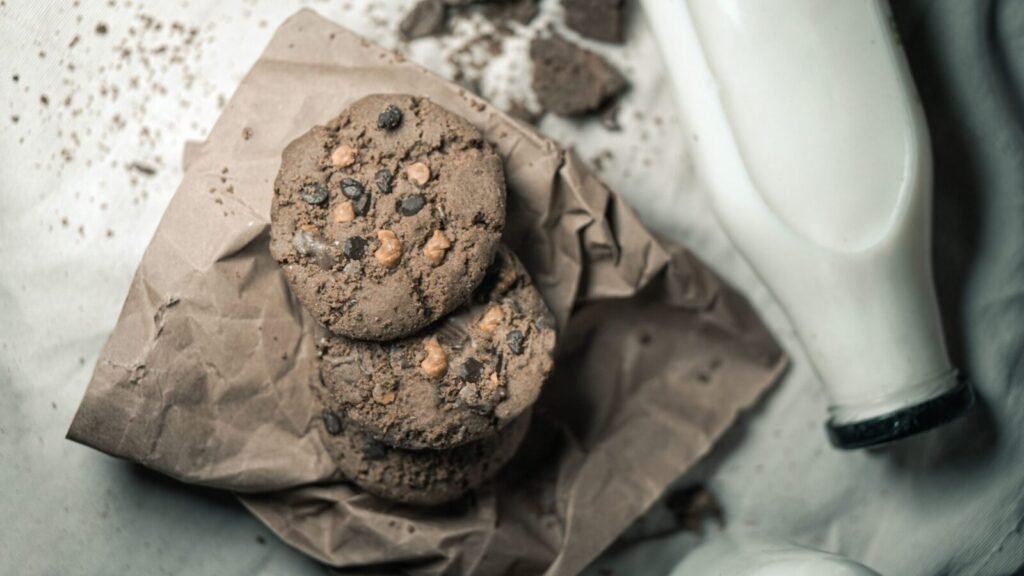 Tasty chocolate chip cookies with milk captured in a cozy, homemade setting.