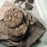 Tasty chocolate chip cookies with milk captured in a cozy, homemade setting.